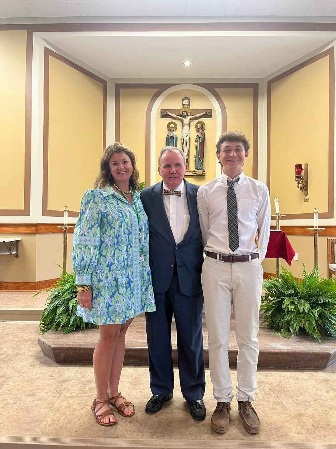 Kevin Sheehan (center) with his former players Kacie Campbell and her son Gabe Campbell.