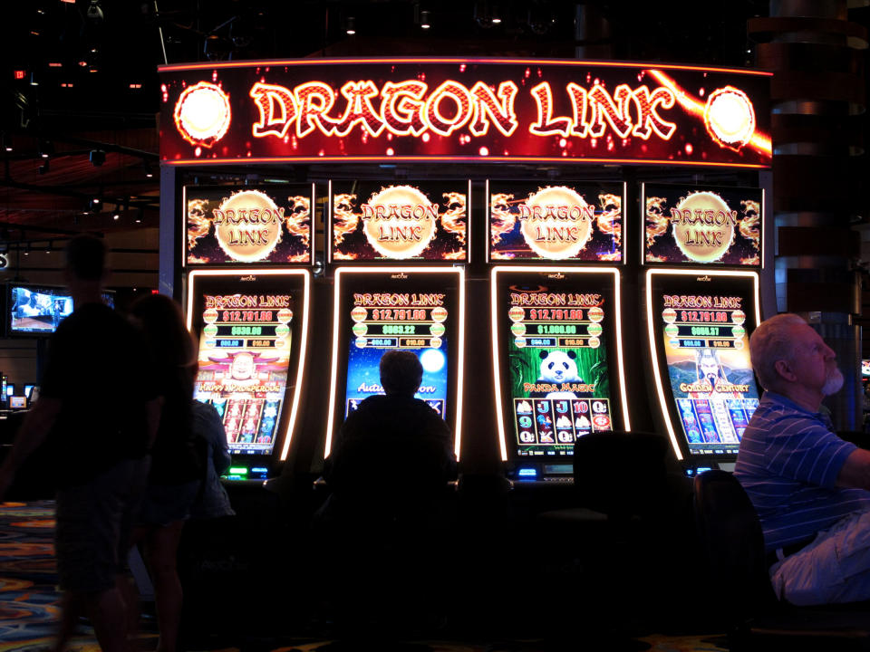 This June 20, 2019 photo shows gamblers playing slot machines at the Ocean Casino Resort in Atlantic City, N.J. The Ocean and Hard Rock casinos both reopened on June 27, 2018, and are fighting for business in the expanded Atlantic City gambling market. (AP Photo/Wayne Parry)