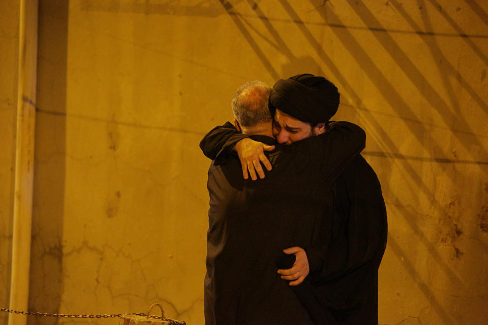 Mourners mourn outside the house of Grand Ayatollah Sayyid Mohammed Saeed al-Hakim in Najaf, Iraq, Friday, Sept. 3, 2021. Mohammed Saeed al-Hakim, one of Iraq's most senior and influential Muslim Shiite clerics, has died, members of his family said. He was 85. (AP Photo/Anmar Khalil)