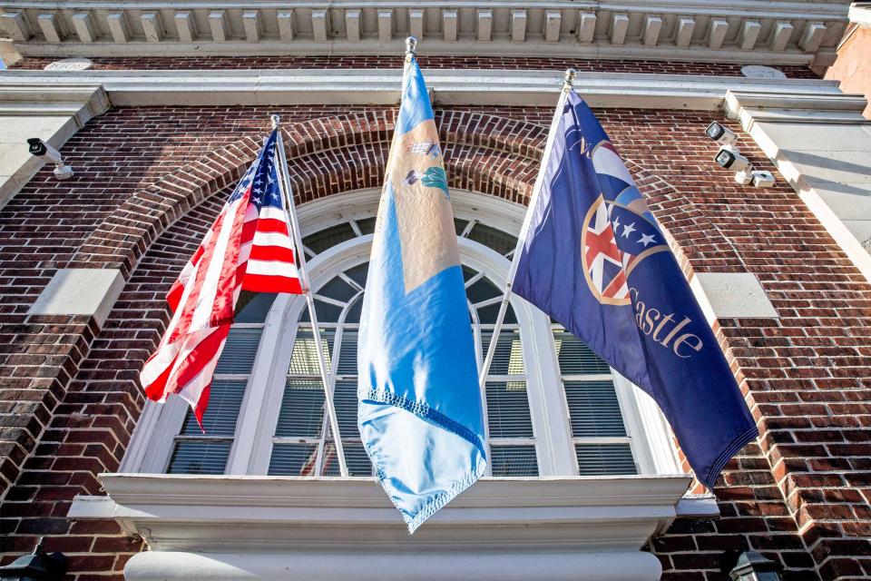 The American, Delaware and New Castle flags are featured on a window of the City of New Castle Mayor's Office in Historic (Old) New Castle, Thursday, February 8, 2024.