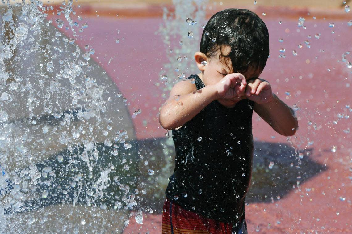 Zaire Prince, 1, plays at Martin Ray Reilly Park’s splash park on a hot Wednesday afternoon, Sept. 7, 2022 in Fresno.