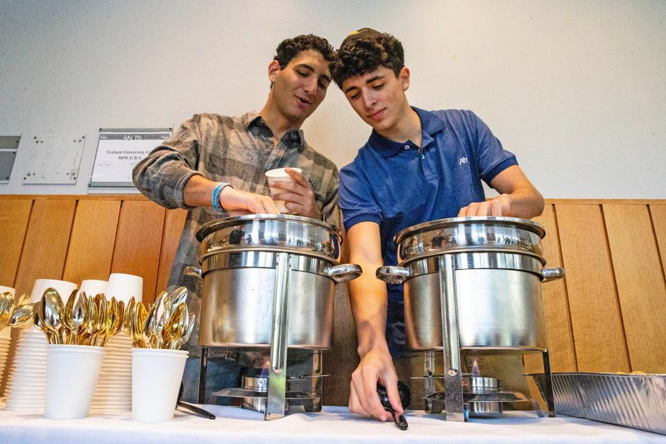 University of Delaware students AJ Goldstein and Ethan Weinerman prepare to serve matzah ball soup during the largest UD hosted Mega Shabbat dinner, with 400 registered to attend and dozens wait listed, at the Trabant University Center in Newark, Friday, Oct. 20, 2023. The Shabbat, planned months ago to proudly showcase the vibrancy of the Jewish community at UD,. took on a slightly different -- but just as important -- significance in light of recent events.