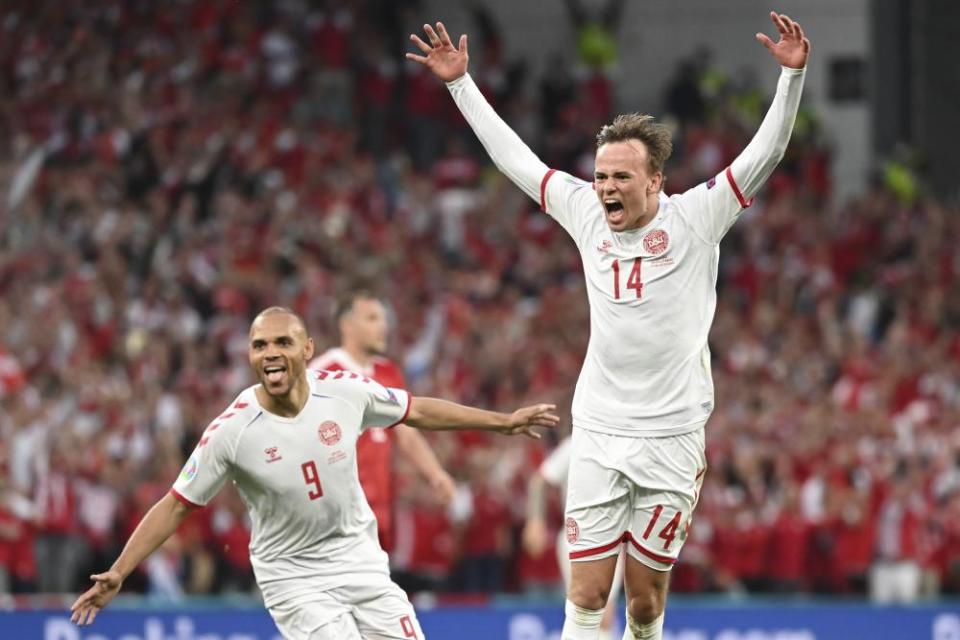 Mikkel Damsgaard scores Denmark’s opener in the 4-1 victory over Russia.