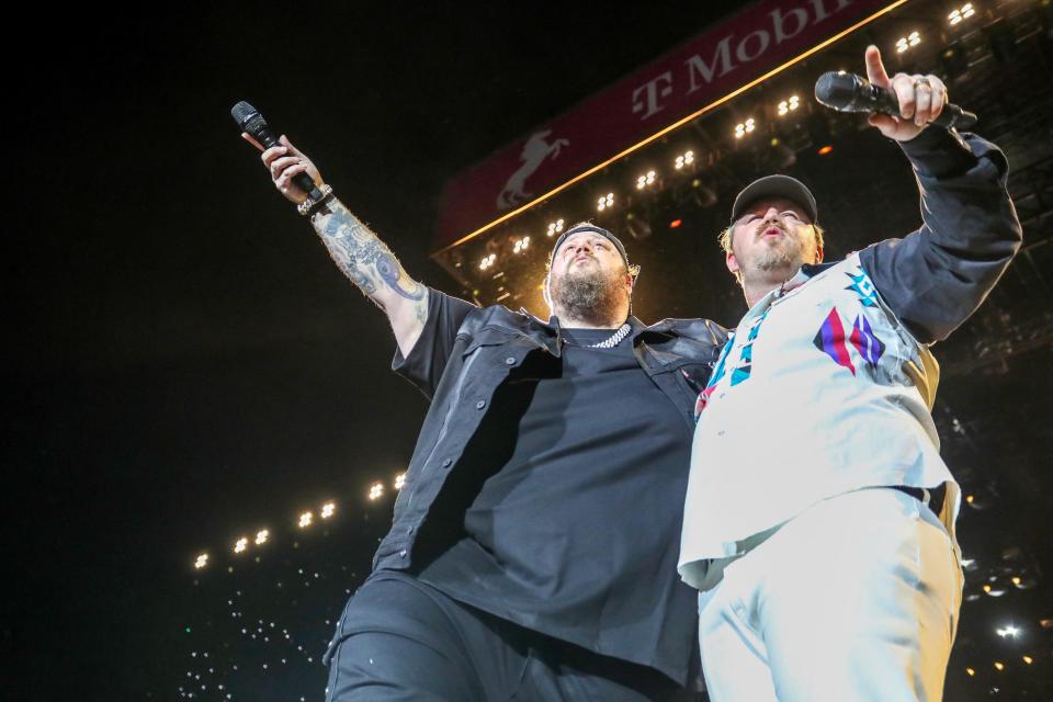 Ernest, right, joins Jelly Roll on the Mane Stage during Stagecoach in Indio, Calif., on Friday, April 26, 2024.