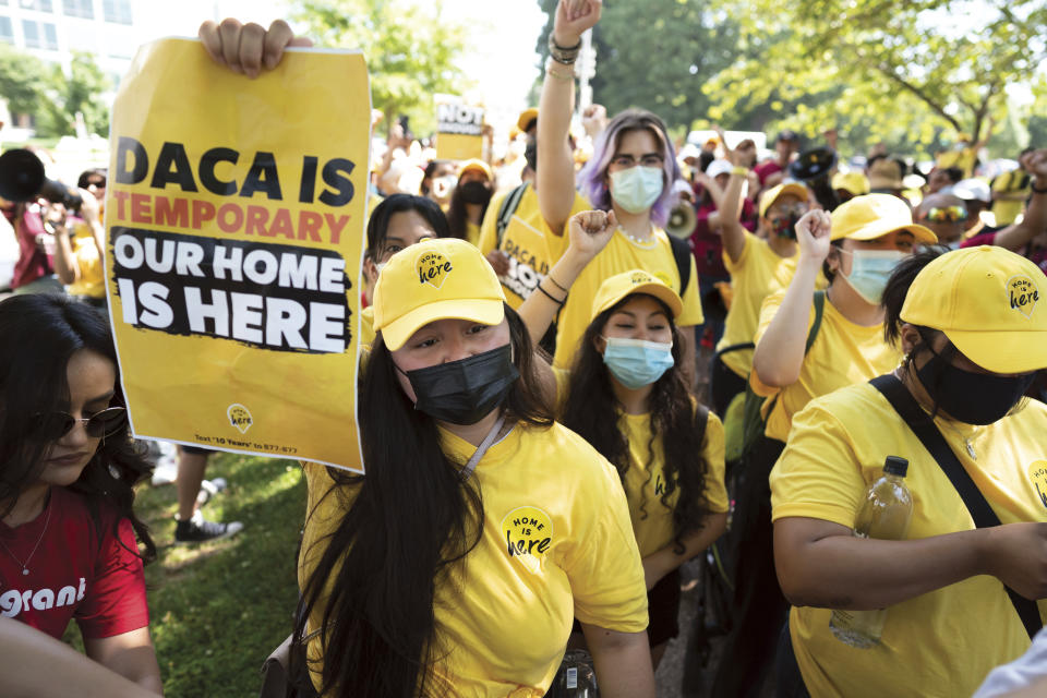 FILE - Susana Lujano, left, a dreamer from Mexico who lives in Houston, joins other activists to rally in support of the Deferred Action for Childhood Arrivals program, also known as DACA, at the U.S. Capitol in Washington on June 15, 2022. The fate of DACA, a program preventing the deportation of hundreds of thousands of immigrants brought into the United States as children, was set Friday, Oct. 14, 2022, to again be in front of a federal judge who has previously declared it illegal. (AP Photo/J. Scott Applewhite, File)