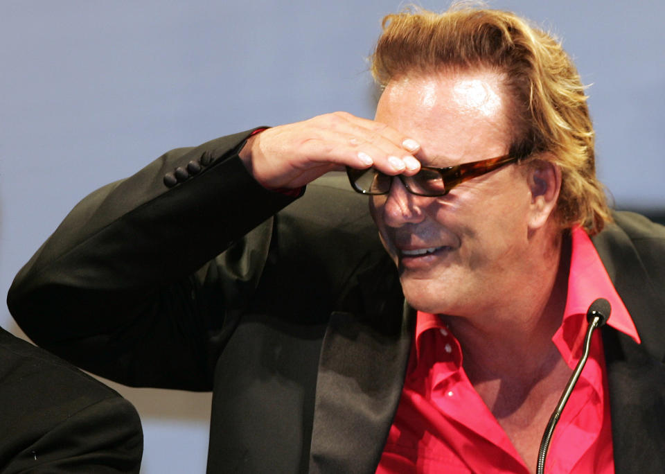 US actor Mickey Rourke looks at guests during bidding at amfAR's Cinema Against AIDS 2005 auction in Mougins. U.S. actor Mickey Rourke looks at guests during bidding at amfAR's Cinema Against AIDS 2005 auction in Mougins, near Cannes, during the 58th Cannes Film Festival, May 19, 2005. REUTERS/Eric Gaillard