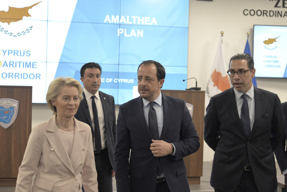 President of the European Commission, Ursula von Der Leyen, left, Cypriot President Nikos Christodoulides, center, and Cypriot foreign minister Constantinos Kombos walk after a press conference at the Joint Search and Rescue Coordination center in Larnaca, Cyprus, on March 8, 2024. Von der Leyen is in Cyprus to inspect facilities at the port of Larnaca from where it's hoped ships will soon start departing for Gaza to deliver aid amid growing international support for the Cypriot initiative to establish a maritime humanitarian corridor to the Palestinian enclave some 240 miles (386 kilometers) away. (AP Photo/Marcos Andronicou)
