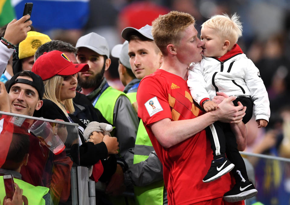 <p>Kevin De Bruyne of Belgium celebrates with his son following his sides victory in the 2018 FIFA World Cup Russia Semi Final match between Belgium and France at Saint Petersburg Stadium on July 10, 2018 in Saint Petersburg, Russia. (Photo by Laurence Griffiths/Getty Images) </p>