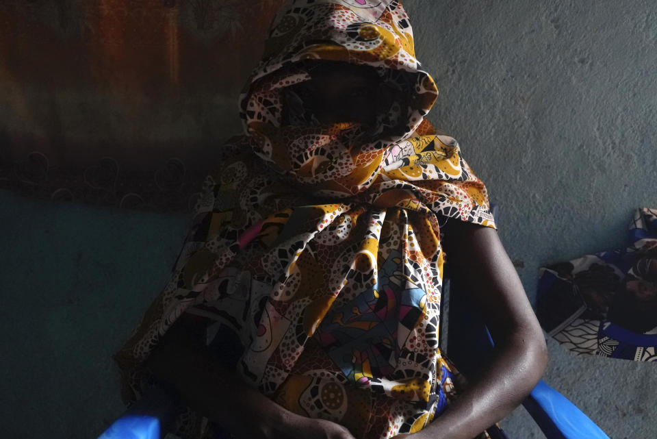 Carole, a 32-year-old former combatant, sits in her home in Bouar, Central African Republic, Thursday, March 7, 2024. Nearly 5,000 fighters have put down their arms in Central African Republic since a disarmament program launched nearly a decade ago. Yet former rebels, communities and conflict experts say it's hard to halt fighting in a country still in conflict and where little other paid work exists. (AP Photo/Sam Mednick)