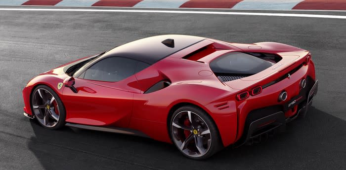 A red Ferrari SF90 Stradale, a low-slung, mid-engined, two-seat hybrid sports car