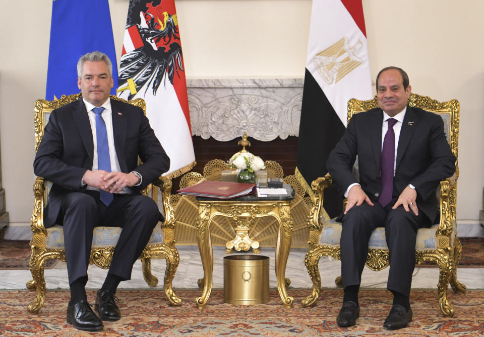 In this photo provided by Egypt's presidency media office, Egyptian President Abdel-Fattah el-Sissi, right, meets Austrian Federal Chancellor Karl Nehammer, left, at the Presidential Palace in Cairo, Egypt, Sunday, March 17, 2024. (Egyptian Presidency Media Office via AP)