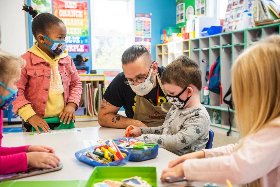 Pre-K teacher Mr. Adam, left, helps Jackson Bourquin, 4, right, at Pattycake Playhouse Early Childhood Learning Center in Newburgh, NY on Monday, November 1, 2021. KELLY MARSH/FOR THE TIMES HERALD-RECORD