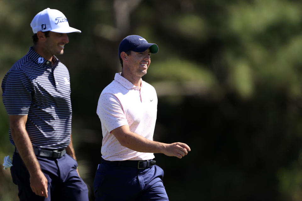 Max Homa of the United States and Rory McIlroy of Northern Ireland walk together during the first round of World Golf Championships-Workday Championship at The Concession on February 25, 2021 in Bradenton, Florida. (Photo by Sam Greenwood/Getty Images)
