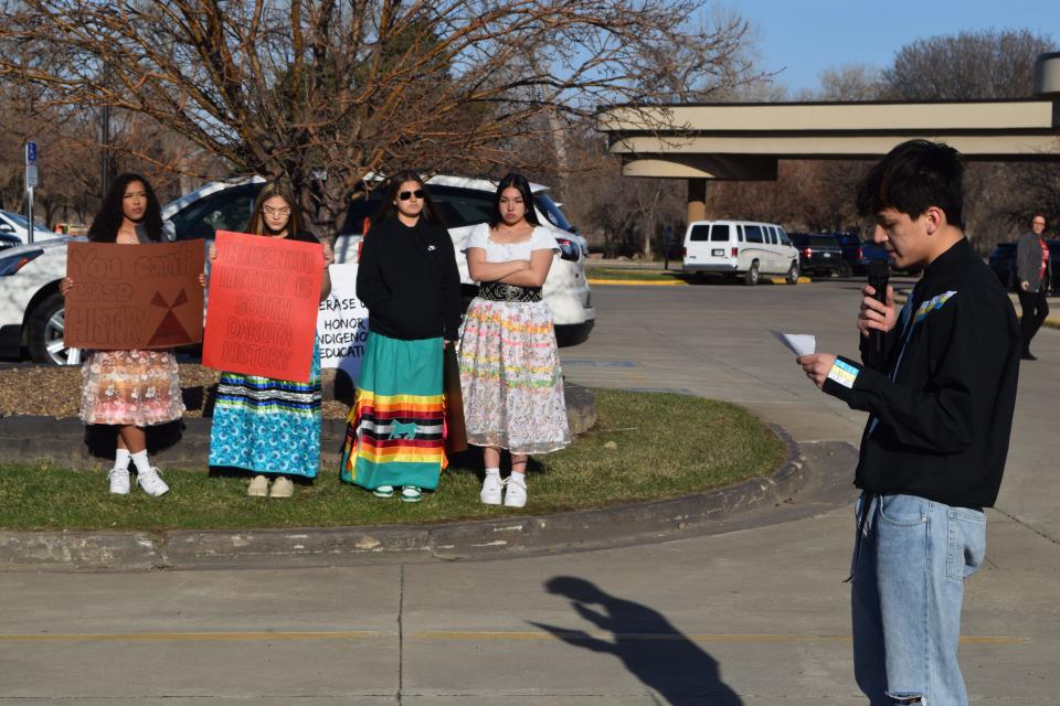 Honz Fuller (far right) speaks against the proposed social studies standards ahead of a Board of Education Standards meeting in Pierre on April 17, 2023 as his peers (left to right) Gabrielle Kenny, Emilee and Lizee DuBray and Alyssa Plamk look on.