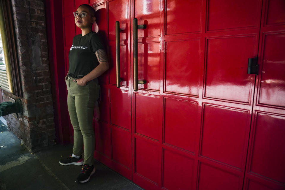 AC Dumlao, chief of staff for Athlete Ally, a group that advocates on behalf of LGBTQ+ and intersex athletes, and a transgender, nonbinary Filipino American, stands for a portrait in New York on Wednesday, May 31, 2023. They will be one of the grand marshals for the 2023 NYC Pride March. (AP Photo/Bebeto Matthews)