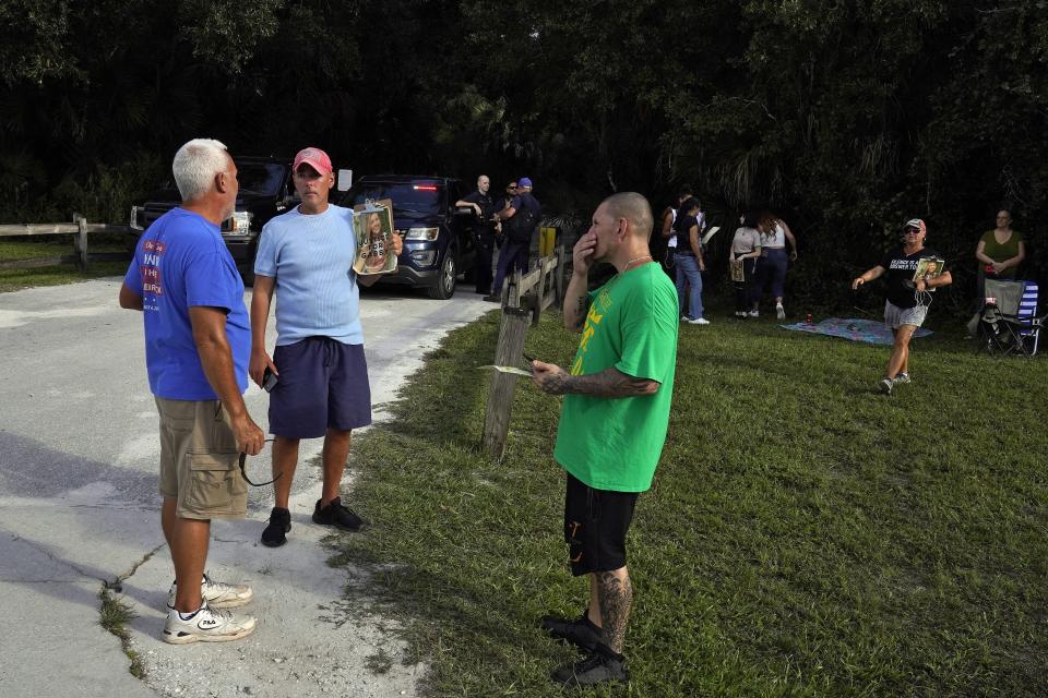 Supporters of Gabby Petito gather outside the Myakkahatchee Creek Environmental Park Wednesday, Oct. 20, 2021, in North Port, Fla.