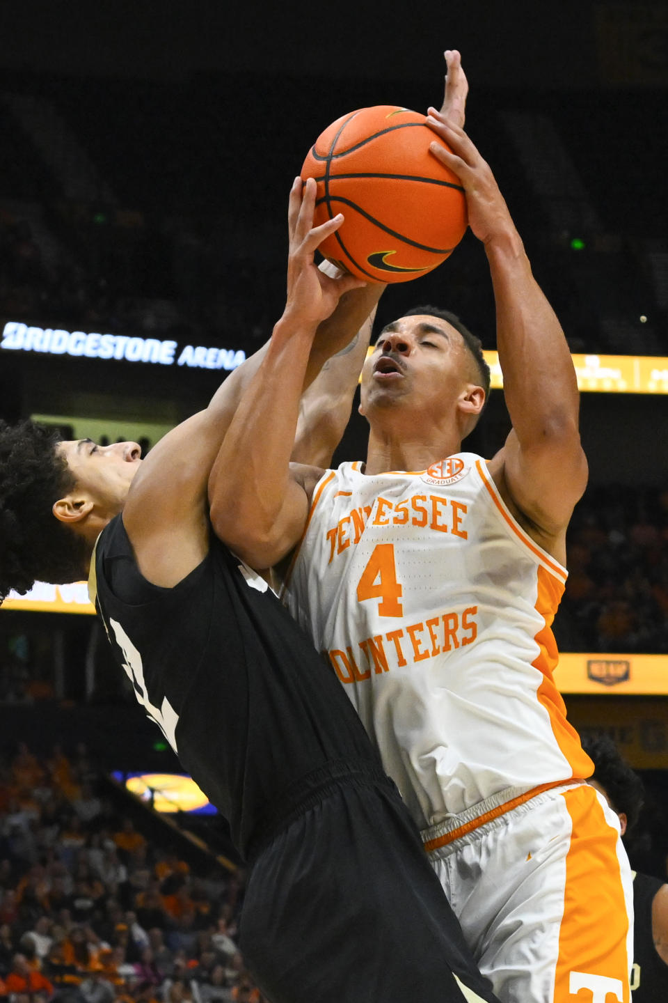 Tennessee guard Tyreke Key (4) shoots as Colorado guard Nique Clifford defends during the first half of an NCAA college basketball game Sunday, Nov. 13, 2022, in Nashville, Tenn. (AP Photo/John Amis)