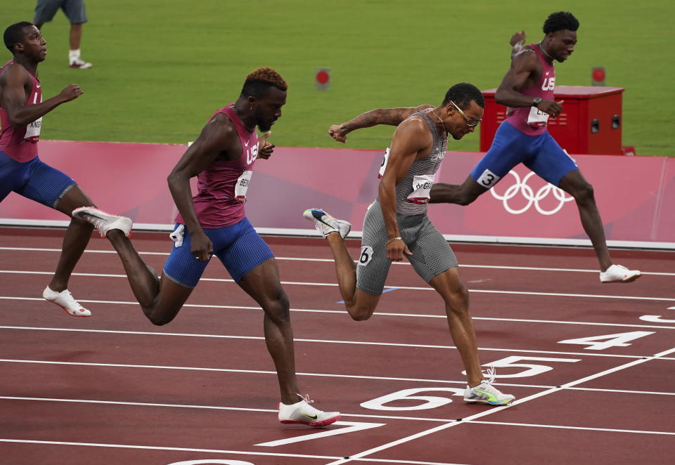 FILE - Andre De Grasse, of Canada, races to win the gold medal ahead of Kenneth Bednarek, foreground, of the United States, silver, and Noah Lyles, right, of the United States, bronze, in the final of the men's 200-meters at the 2020 Summer Olympics, Wednesday, Aug. 4, 2021, in Tokyo, Japan. De Grasse manages to stay under the radar most of the time, but has a knack for turning up big when the lights are shining the brightest. (Nathan Denette/The Canadian Press via AP, File)