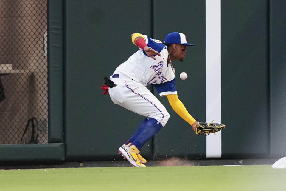 Atlanta Braves right fielder Ronald Acuna Jr. can't reach a ball hit for a double by Milwaukee Brewers' Hunter Renfroe during the fourth inning of a baseball game Friday, May 6, 2022, in Atlanta. (AP Photo/John Bazemore)