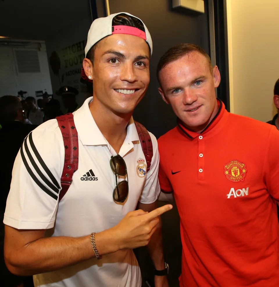 ANN ARBOR, MI - AUGUST 02: (EXCLUSIVE COVERAGE) Wayne Rooney of  Manchester United poses with Cristiano Ronaldo of Real Madrid after their pre-season friendly match against Real Madrid at Michigan Stadium on August 2, 2014 in Ann Arbor, Michigan.  (Photo by John Peters/Manchester United via Getty Images)