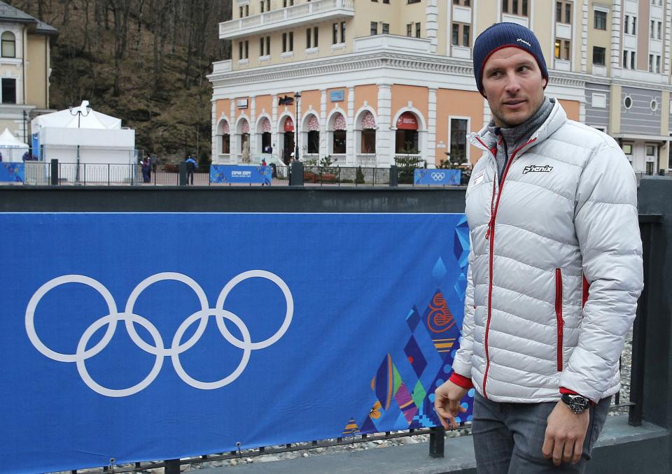 Norway's Aksel Lund Svindal takes a walk through the streets of the Rosa Khutor ski resort in Krasnaya Polyana, Russia at the Sochi 2014 Winter Olympics, Monday, Feb. 17, 2014. Svindal is leaving the Olympics because he has problems with allergies and fatigue, the Norwegian men's Alpine skiing coach said Monday. (AP Photo/Christophe Ena)