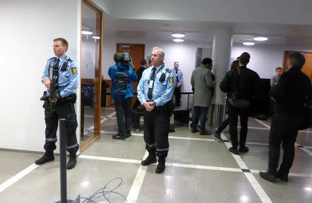 Armed police guard the courtoom in Oslo District Court, where a judge is deciding on the detention of a 17-year-old Russian, suspected of planting a bomb-like device on Saturday, in central Oslo, Norway April 10, 2017. REUTERS/Gwladys Fouche