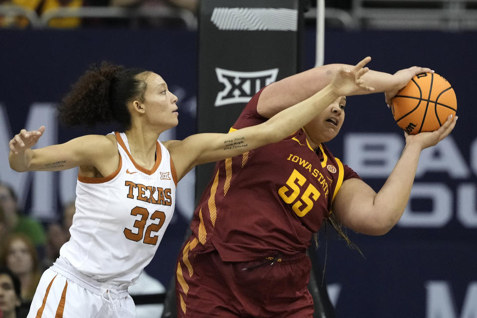Texas guard Ndjakalenga Mwenentanda (32) tries to steal the ball from Iowa State center Audi Crooks (55) during the first half of an NCAA college basketball game for the Big 12 women's tournament championship Tuesday, March 12, 2024, in Kansas City, Mo. (AP Photo/Charlie Riedel)
