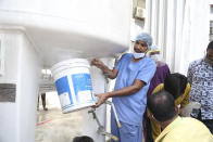 Hospital staff fix the leakage in their oxygen plant in Nashik, in the Indian state of Maharashtra, Wednesday, April 21, 2021. A local administrator in western India says 22 patients have died in a hospital when their oxygen supply was interrupted by a leakage in a supply tank. The official says the oxygen supply has since been resumed to other patients. (AP Photo)