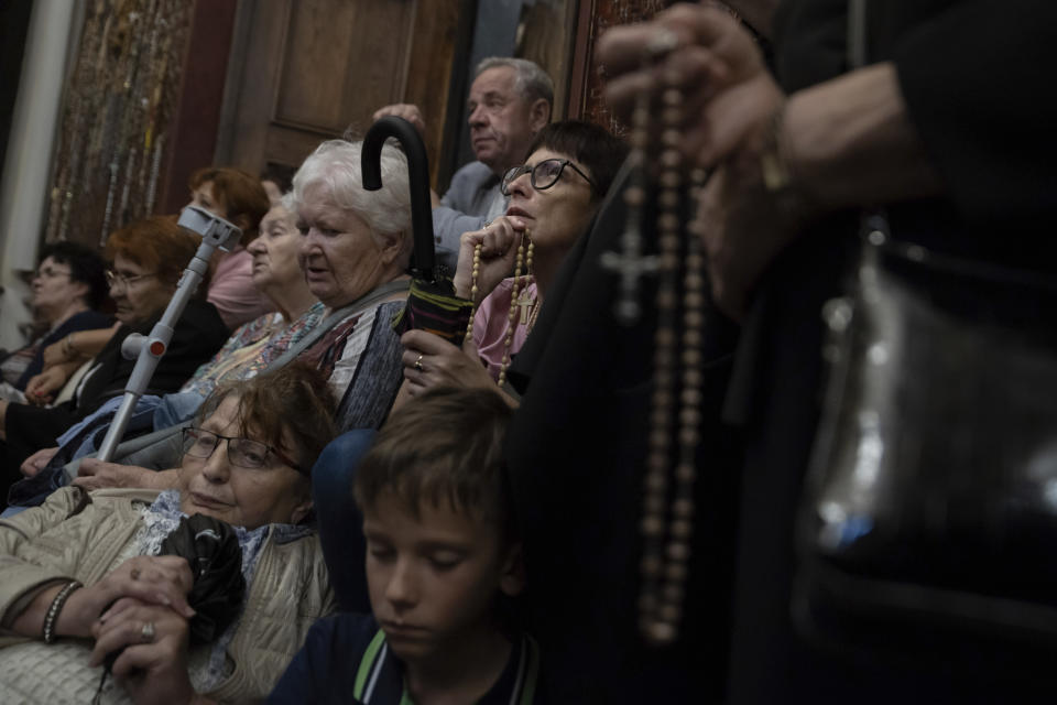 People pray with rosaries at the Jasna Gora Monastery, Poland's most revered Catholic shrine, in Czestochowa, Poland, Saturday, Sept. 23, 2023. (AP Photo/Michal Dyjuk)