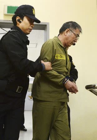 Lee Joon-seok, captain of the sunken Sewol ferry, arrives at a court in Gwangju November 11, 2014. REUTERS/News1/Korea Pool