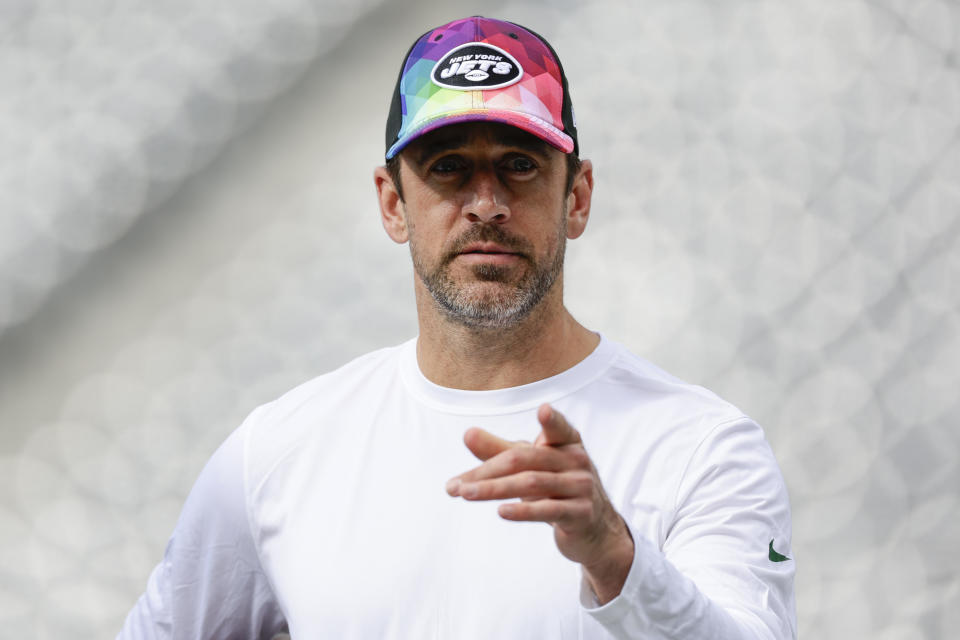 New York Jets quarterback Aaron Rodgers walks on the field before an NFL football game against the Philadelphia Eagles, Sunday, Oct. 15, 2023, in East Rutherford, N.J. (AP Photo/Adam Hunger)