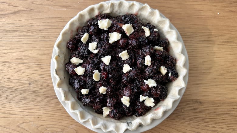 blackberry pie with butter dollops