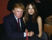 UNITED STATES - CIRCA 2000: Donald Trump and girlfriend Melania Knauss share a table at the opening of the new Times Square Planet Hollywood at Broadway and 45th St. Launch was a benefit for the wildlife-care organization Stars in the Wild. (Photo by Richard Corkery/NY Daily News Archive via Getty Images)