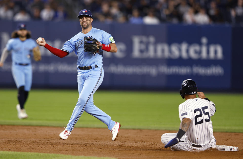 Toronto Blue Jays second baseman Whit Merrifield holds the throw after forcing out New York Yankees' Gleyber Torres at second base on a ball hit by Austin Wells during the third inning of a baseball game Wednesday, Sept. 20, 2023, in New York. (AP Photo/Noah K. Murray)