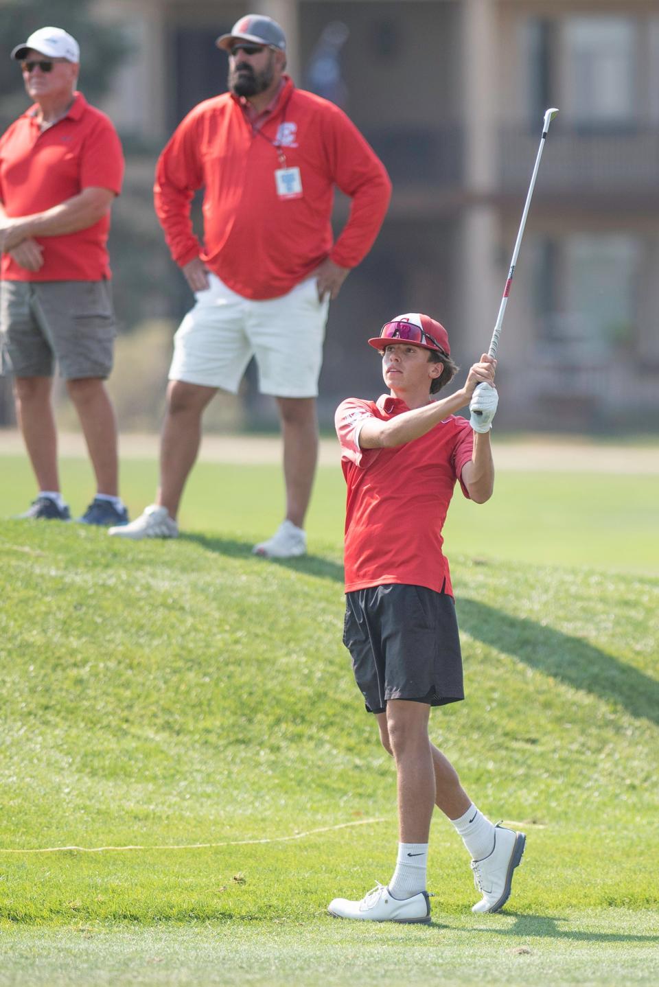 Pueblo Centennial's Alex Navarette watches his fairway shot on the second hole at Walking Stick Golf Course during the state tournament on Tuesday, October 8, 2024.