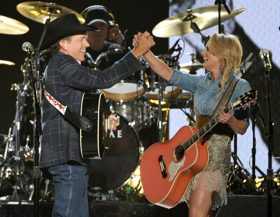 George Strait, left, and Miranda Lambert perform on stage at the 49th annual Academy of Country Music Awards at the MGM Grand Garden Arena on Sunday, April 6, 2014, in Las Vegas. (Photo by Chris Pizzello/Invision/AP)