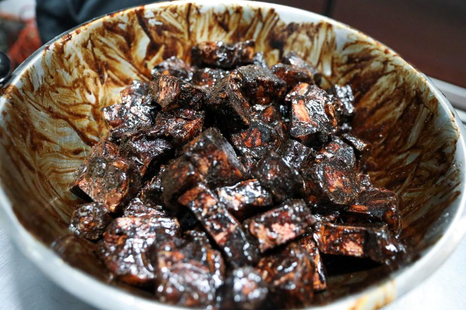 Ox tail is prepared at Kinfolk Southern Eats and Treats on Thursday, June 4, 2020, in Fort Pierce. ”Nothing is out of a can,” said Willie Roundtree, co-owner of Kinfolk. “Everything’s fresh.” The restaurant offers specialty dishes daily and the smothered pork and chitlins are among his customers favorites. 