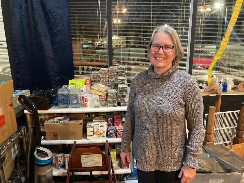 Linda James stands at the future location of 201 Cafe and Wine BAr, the former Razzleberr's location in Jackson Square.