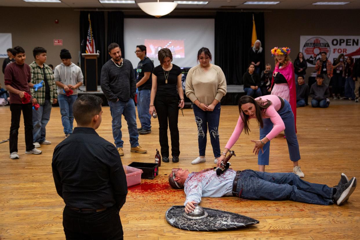 Natalia Lee, the armorer for Game of Thrones, choreographs a fight scene with students on Wednesday, Dec. 14, 2022, at Deming Early College High School. "The kids are our future," says Lee, "We want Hollywood to be more diverse... we want everybody. So if you have a 'disadvantage' we want to turn that into an advantage."