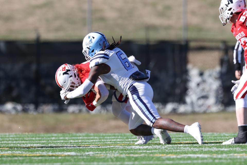 Keiser linebacker Jaelin Willis makes a tackle against Northwestern (Iowa) during Monday's game.