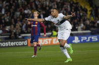 PSG's Kylian Mbappe celebrates after scoring his side's third goal during the Champions League quarterfinal second leg soccer match between Barcelona and Paris Saint-Germain at the Olimpic Lluis Companys stadium in Barcelona, Spain, Tuesday, April 16, 2024. (AP Photo/Emilio Morenatti)