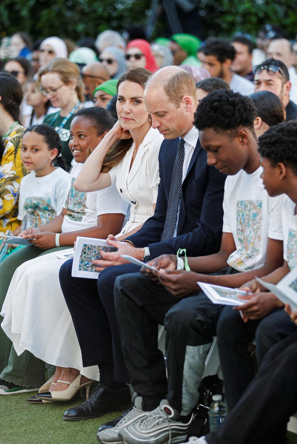 Britain's Catherine, Duchess of Cambridge and Britain's Prince William, Duke of Cambridge (C) attend a memorial service at the foot of Grenfell Tower in London, on June 14, 2022, the fifth anniversary of the Grenfell Tower fire where 72 people lost their lives. - The names of the 72 people who perished in Britain's worst residential fire since World War II were read out on June 14, 2022 at a church service marking the fifth anniversary of the blaze. Survivors and families of the victims of the Grenfell Tower fire gathered at Westminster Abbey for the first of a day of events to remember the tragedy. (Photo by PETER NICHOLLS / POOL / AFP) (Photo by PETER NICHOLLS/POOL/AFP via Getty Images)