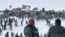 <p>A stirring photo of Standing Rock protestors braving the elements.<br> It won top prize in the ‘America I know’ category (Picture: IPP) </p>