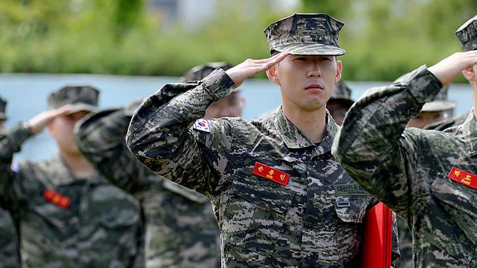 Tottenham Hotspur forward Son Heung-min salutes during the completion ceremony at a Marine Corps boot camp in Seogwipo, Jeju, South Korea. - Republic of Korea Marine Corps/Getty Images