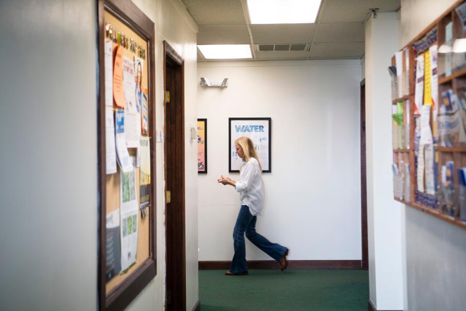 Kate Hull, head of nursing, hustles to help a patient at the Free Medical Clinic of Oak Ridge.