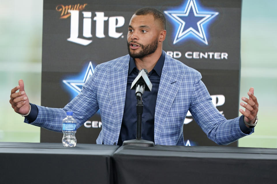 Dallas Cowboys quarterback Dak Prescott speaks during a news conference at the team's NFL football practice facility in Frisco, Texas, Wednesday, March 10, 2021. The Cowboys and Prescott have finally agreed on the richest contract in club history, two years after negotiations began with the star quarterback. (AP Photo/LM Otero)