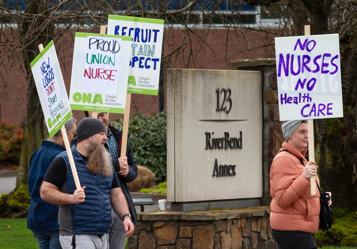 Nurses walk the picket line near the PeaceHealth River Bend Annex on East International Way in Springfield on Monday. The picketers, on strike from PeaceHealth Sacred Heart Home Care Services, said they plan to continue picketing until the strike is scheduled to end on Feb. 24.