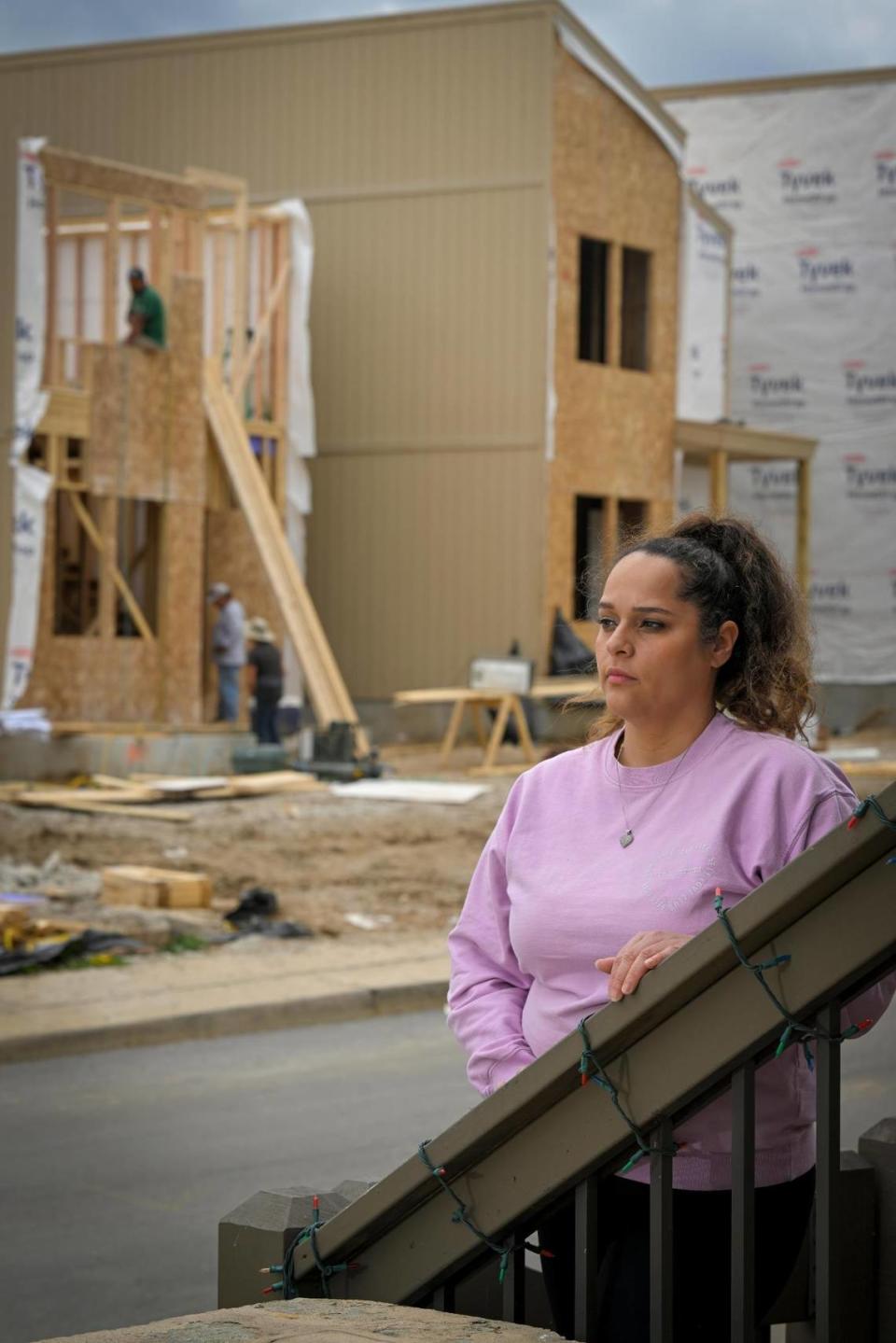 Monique Ortiz, raised on the West Side, lives with her family in a 120-year-old home on Mercier Street. Her new neighbors will occupy 16 new contemporary houses. “It’s like one world is here and, across the street, is another. It changes the culture.” she said.