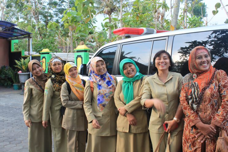 Midwives who work with the U.N. Population Fund stand outside a maternity clinic in rural Java, Indonesia. (Photo: Mikaela Conley/Yahoo News)