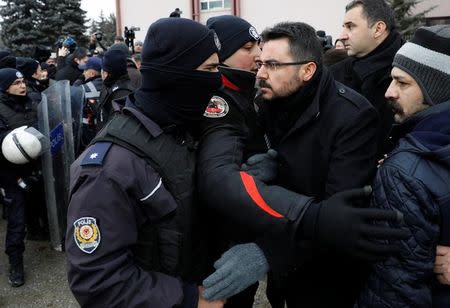Riot police scuffle with protesters trying to march to the Turkish Parliament as the lawmakers gather to debate the proposed constitutional changes in Ankara, Turkey, January 9, 2017. REUTERS/Umit Bektas
